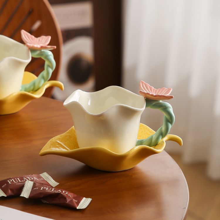 Flower and butterfly ceramic coffee cups and saucers