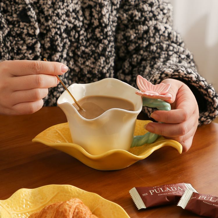 Flower and butterfly ceramic coffee cups and saucers