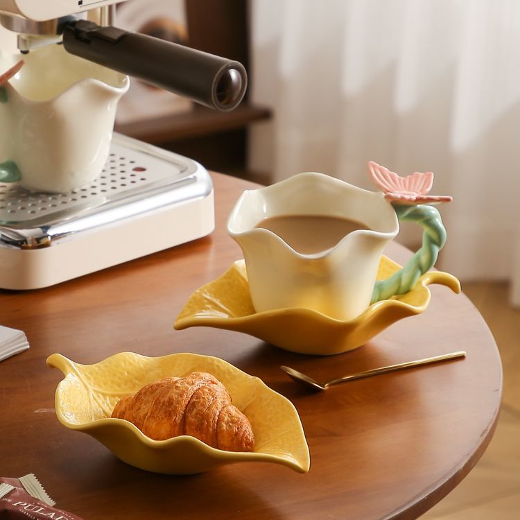 Flower and butterfly ceramic coffee cups and saucers