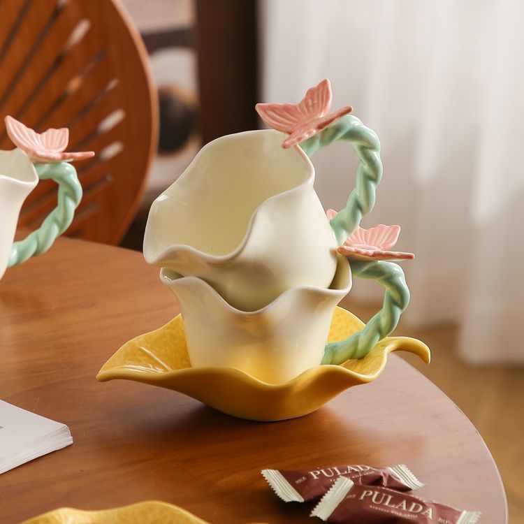 Flower and butterfly ceramic coffee cups and saucers